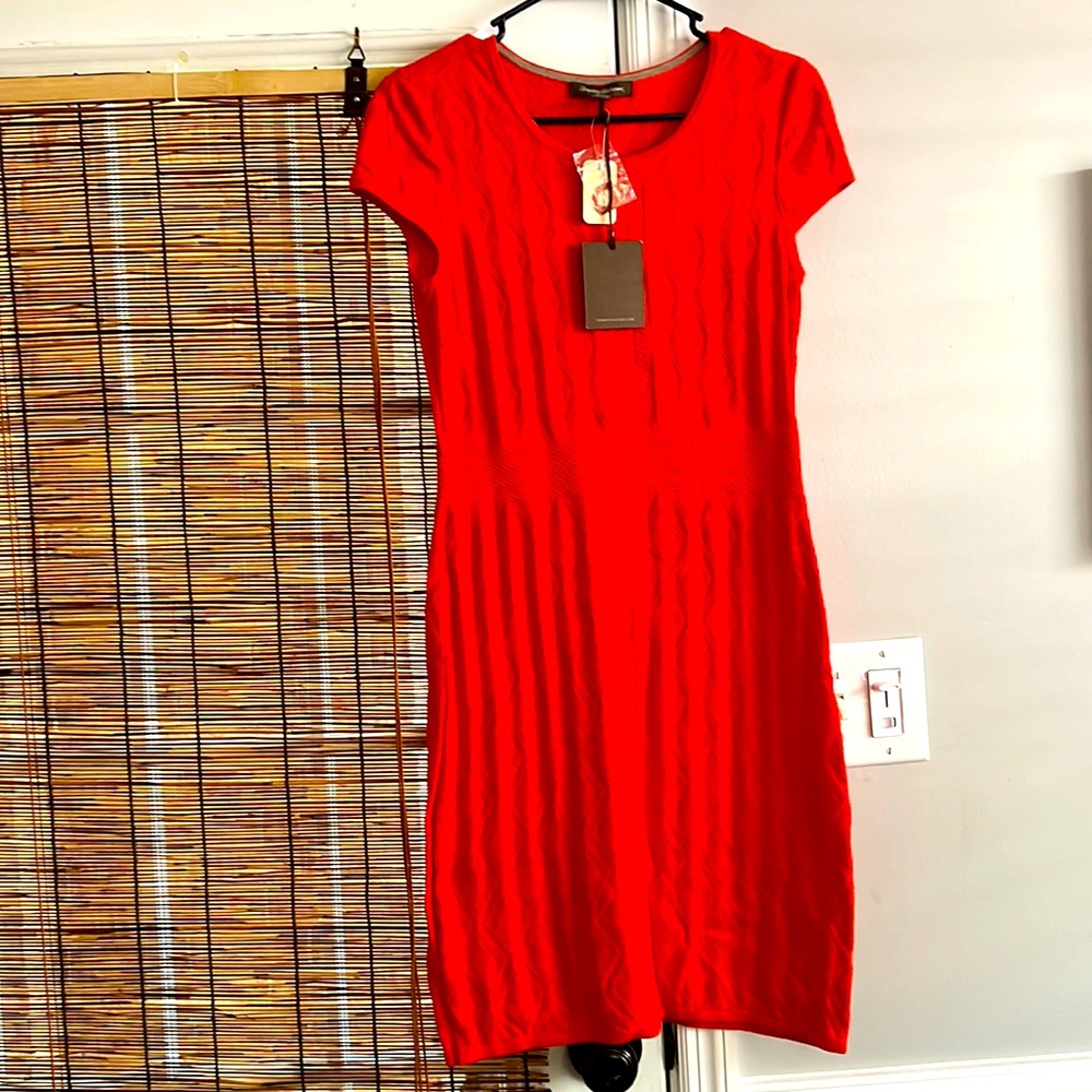 Women’s new with tags Tommy Bahama dress size XS.It’s  a knit deep coral color.